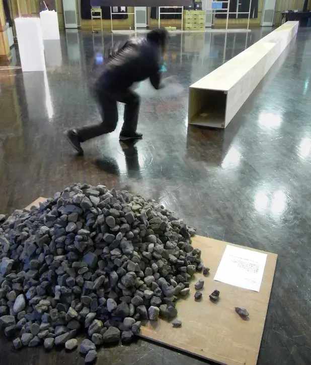“Throw a Stone”. Instructions, visitors, stones, wood. 2010