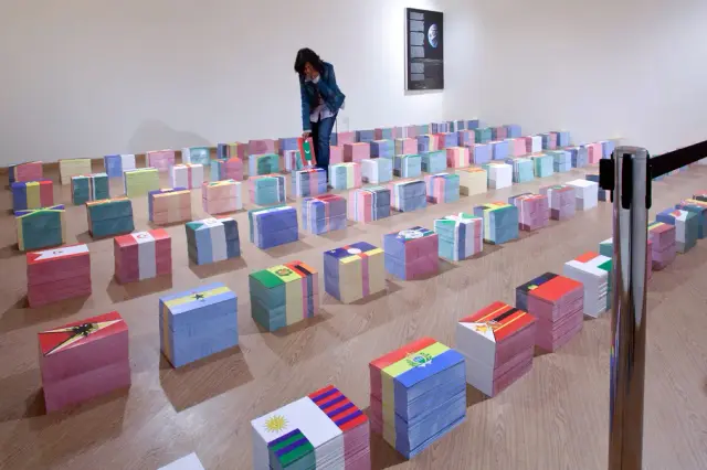 “The Half-Eaten Earth, The Eclipse of National Flags, One Eye”. Printed materials, writing, instructions, visitors. 2011-2012.