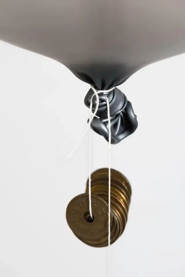 Ducks and Drakes, 2014 Latex balloons, Hi-Float, helium, waxed linen thread, aluminium, coins Dimensions variable, unique in series